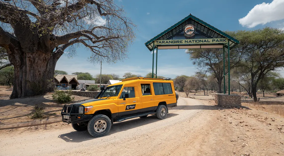 Altezza Travel's safari jeep at the entry gates to the Tarangire National Park