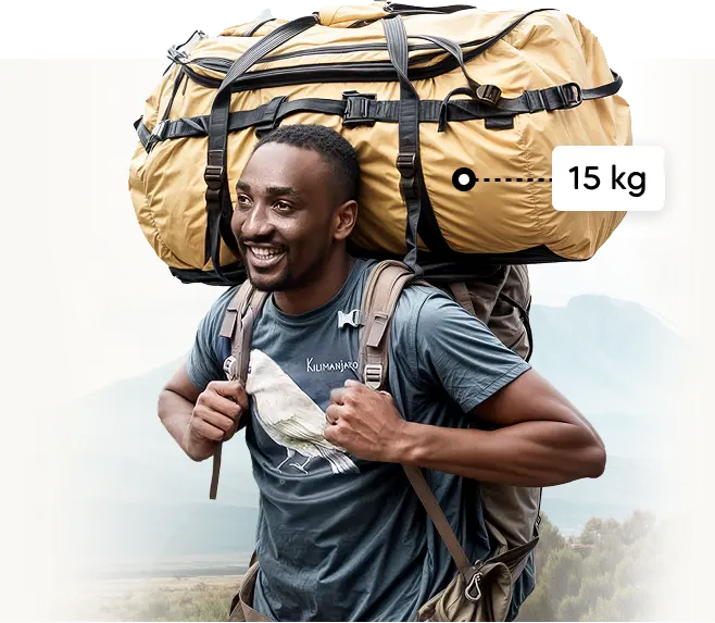 Kilimanjaro porter carrying a 15 kg expedition duffel bag Kilimanjaro porter carrying a 15 kg expedition duffel bag